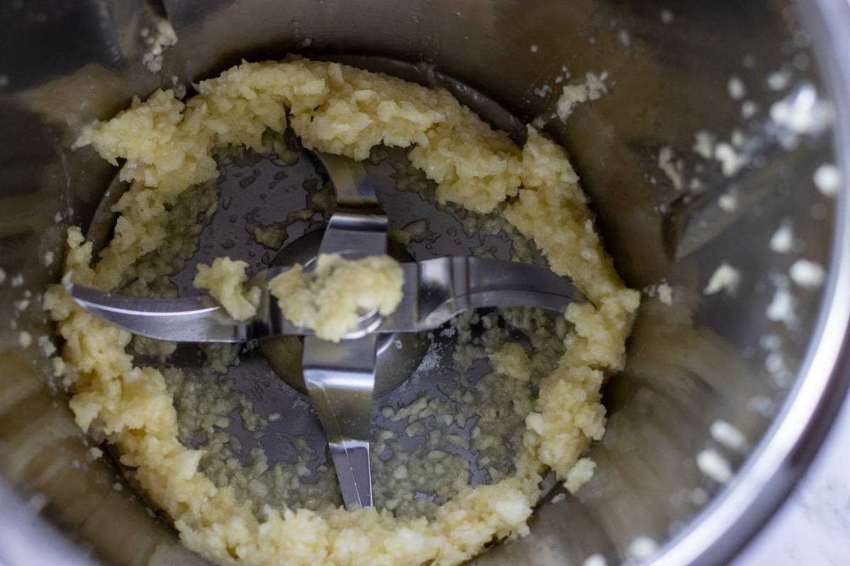 garlic is pureed in a food processor