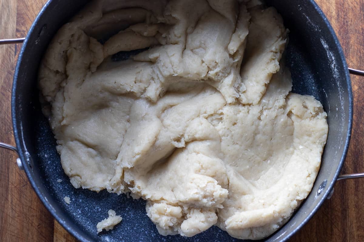 flour is added to boiling water to form a dough