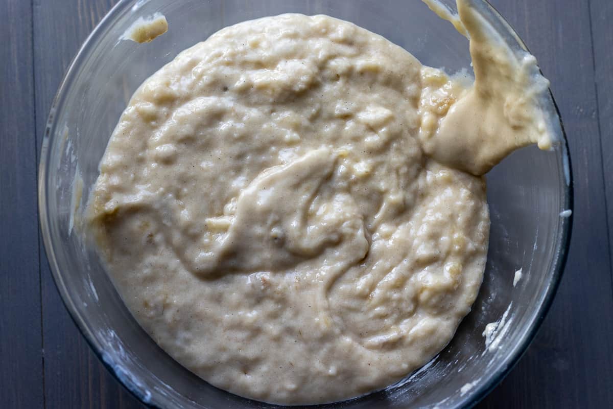 flour is gently added to wet ingredients to form a batter