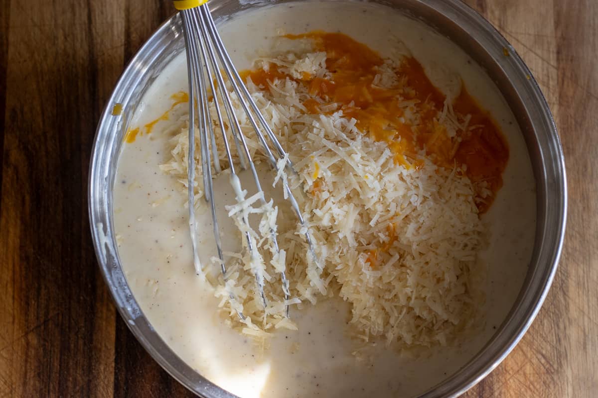 egg yolk and cheese are added to the béchamel