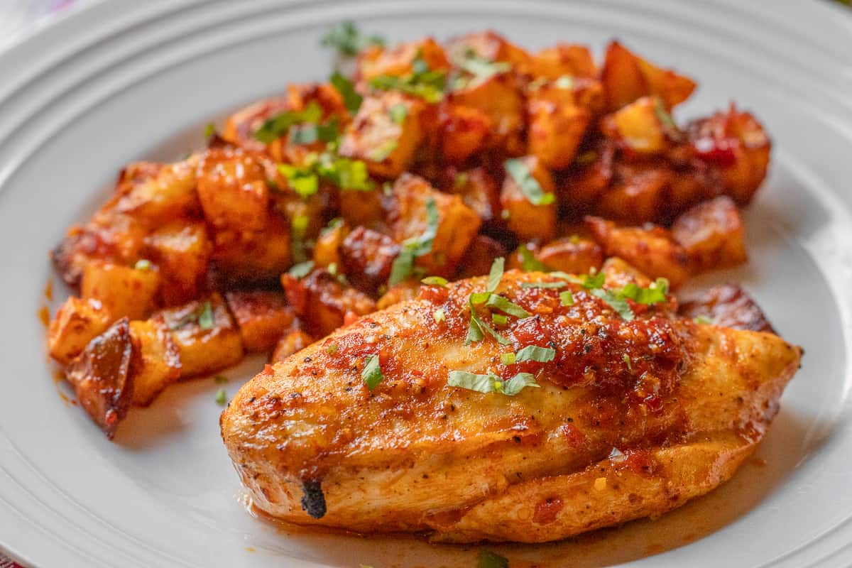 harissa chicken served with Batata Harra