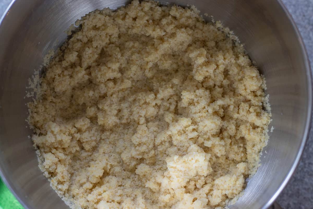 Fine bulgur is placed in a bowl of a stand mixer alomg with water.