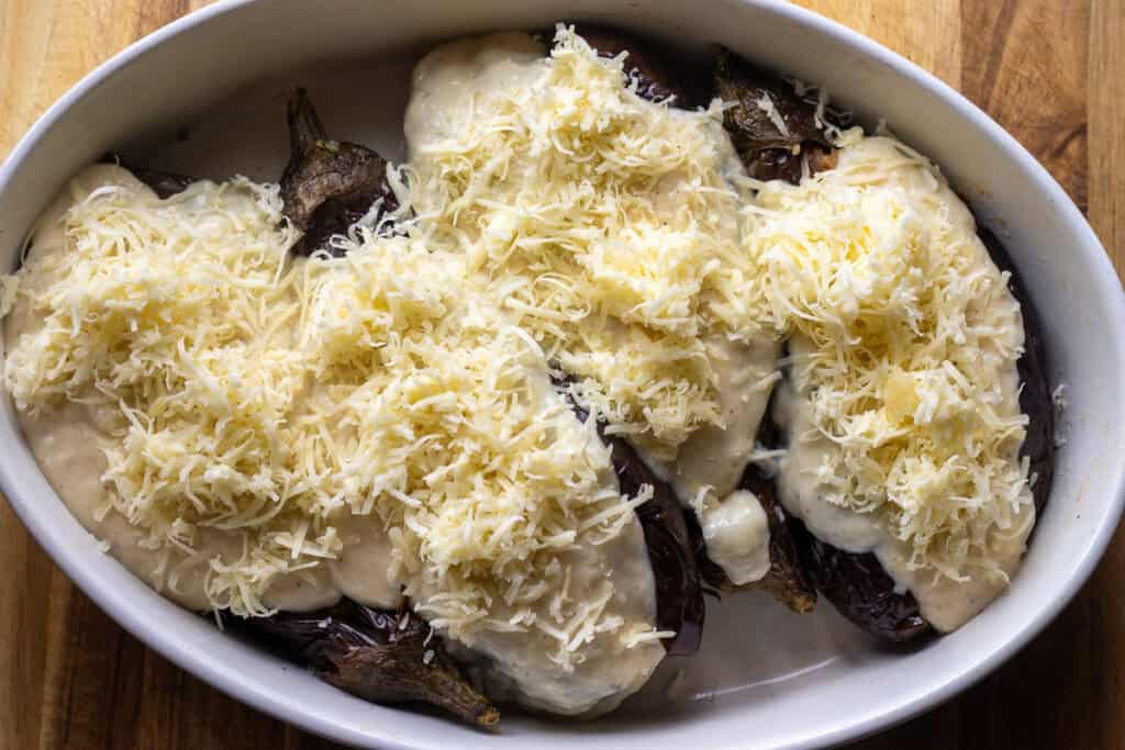 eggplants are sprinkled on grated cheese