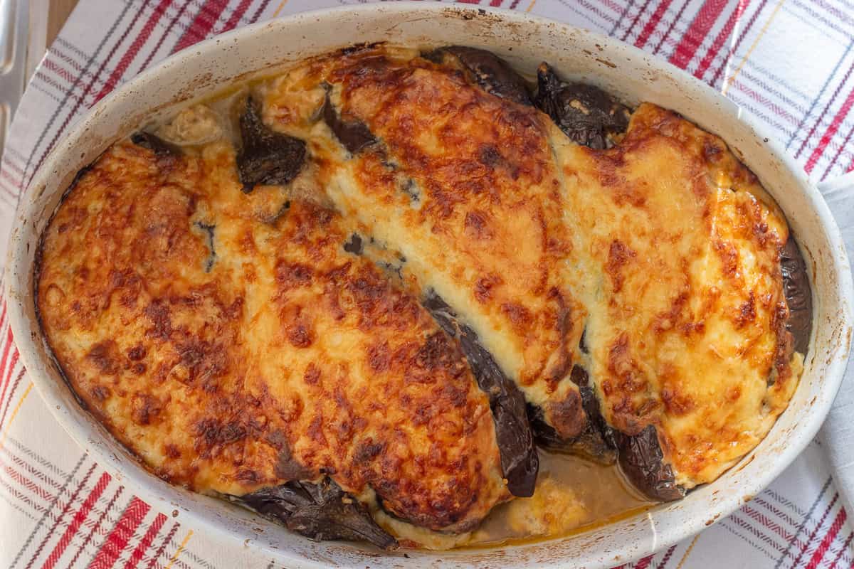 papoutsakia - vegetarian greek stuffed eggplants are baked until golden and bubbly