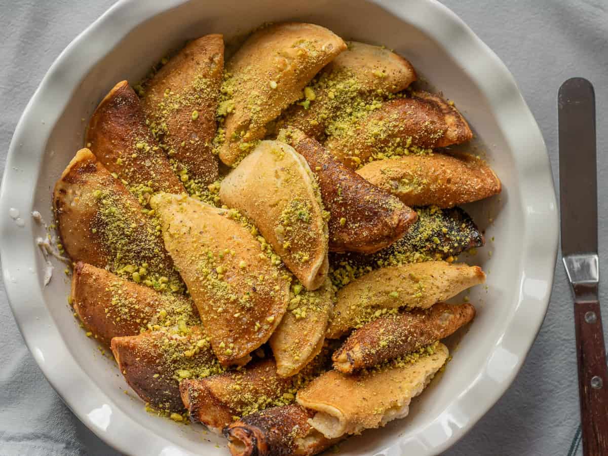 21 pieces of katayef baked and drizzled with simple syrup