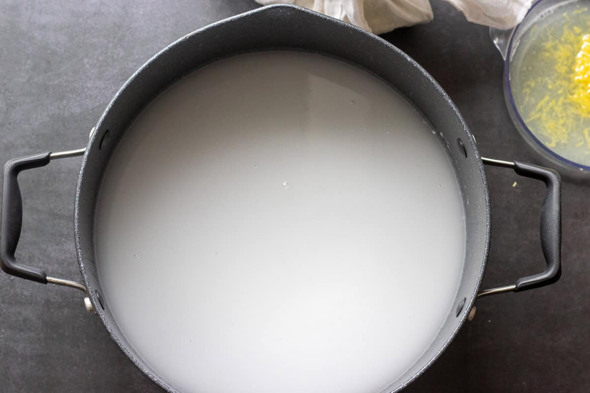 sugar and water are placed in a large pan