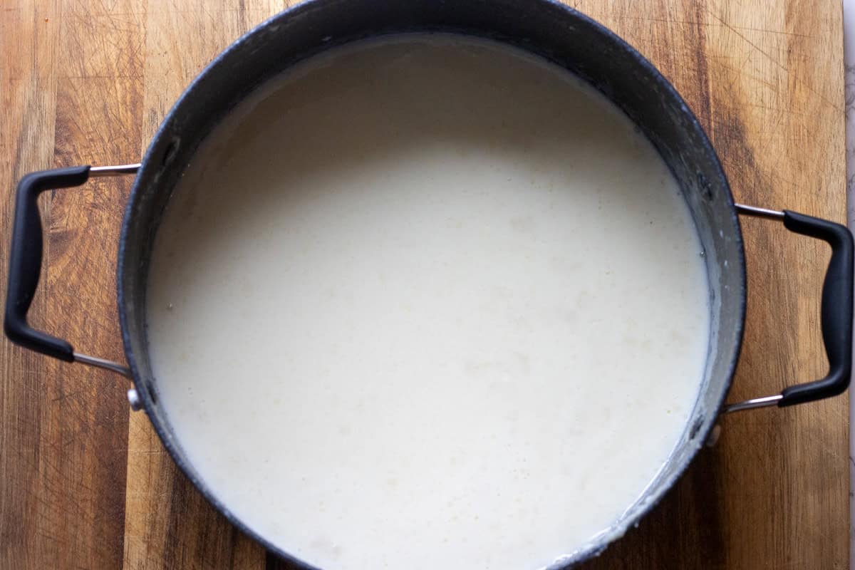 Turkish ice cream mixture of milk, shlep, sugar, cream and mastic in a saucepan