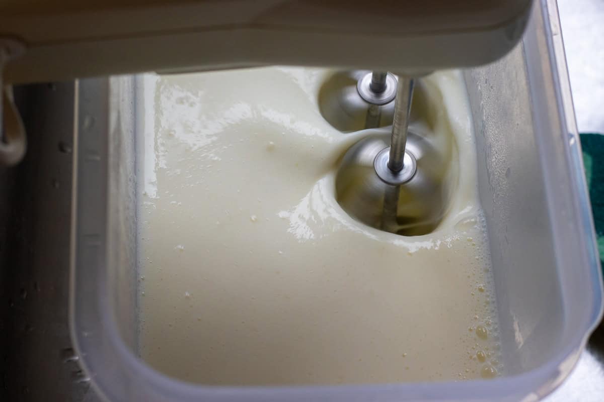 whisking the ice cream mixture to cool it down