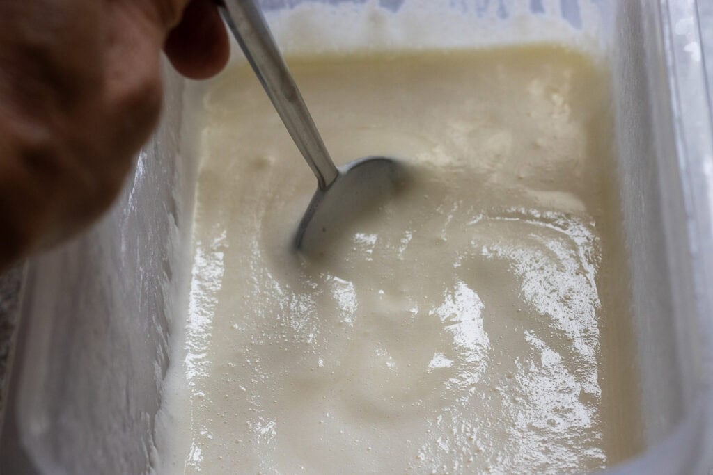 mixing the ice cream mixture with a spoon