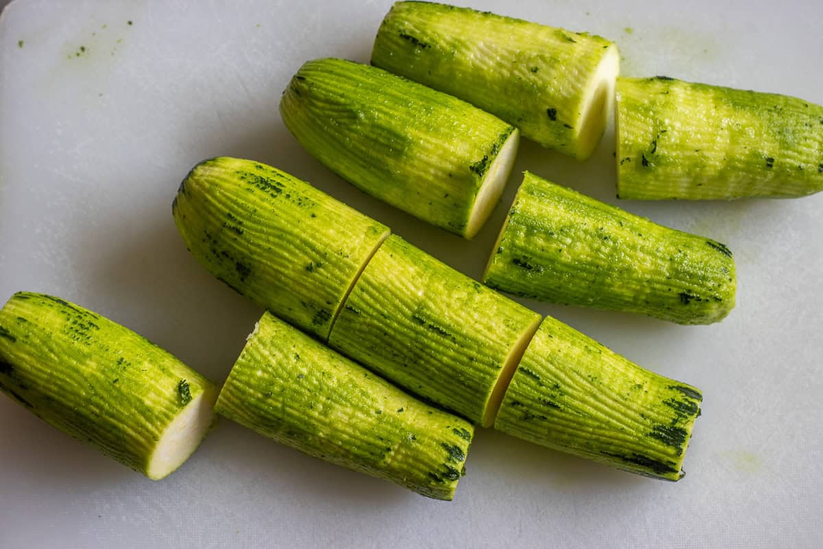 zucchinis are washed, peeled, and cut