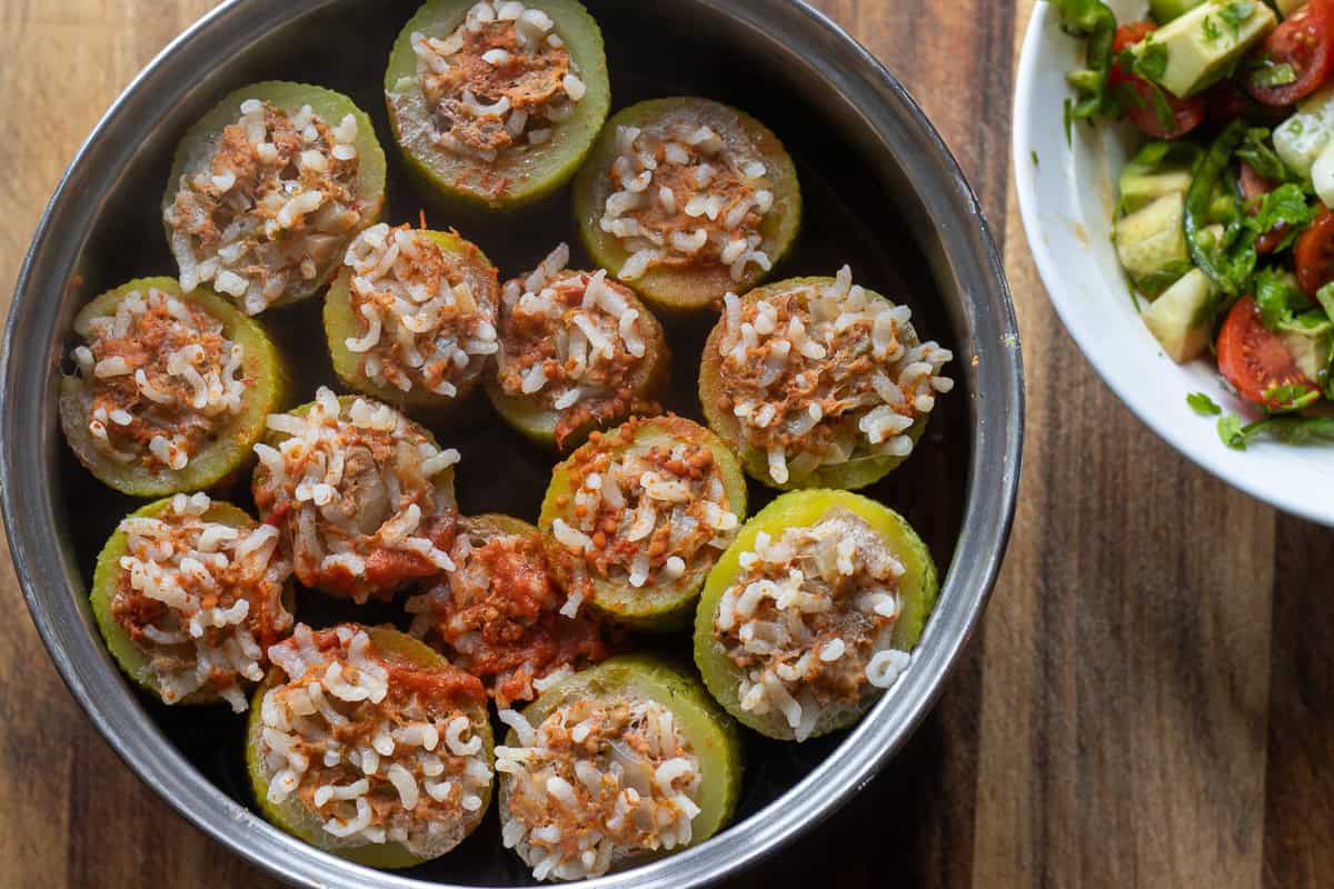 stuffed zucchinis cooked until the rice and the zucchinis are tender