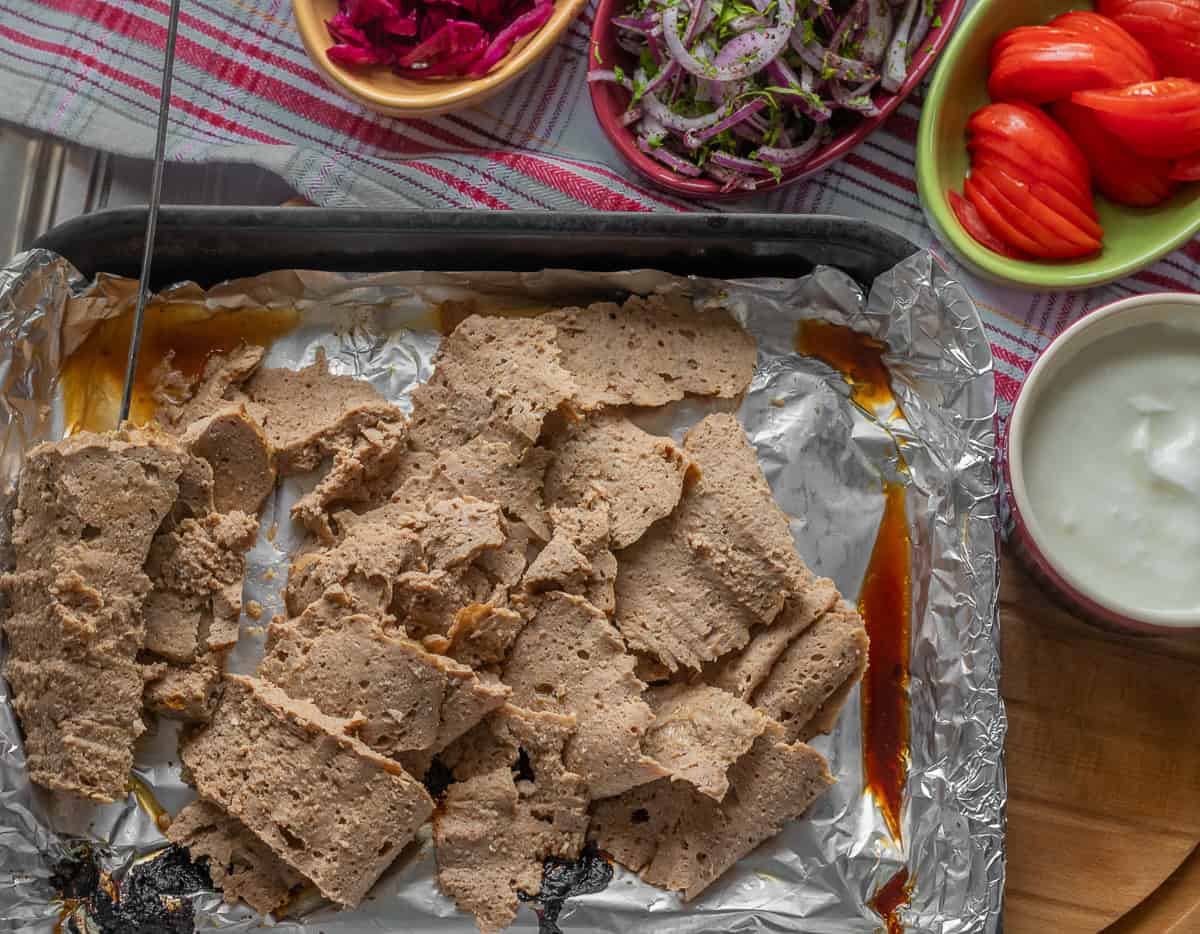 Turkish doner kebab served with salads and sauce