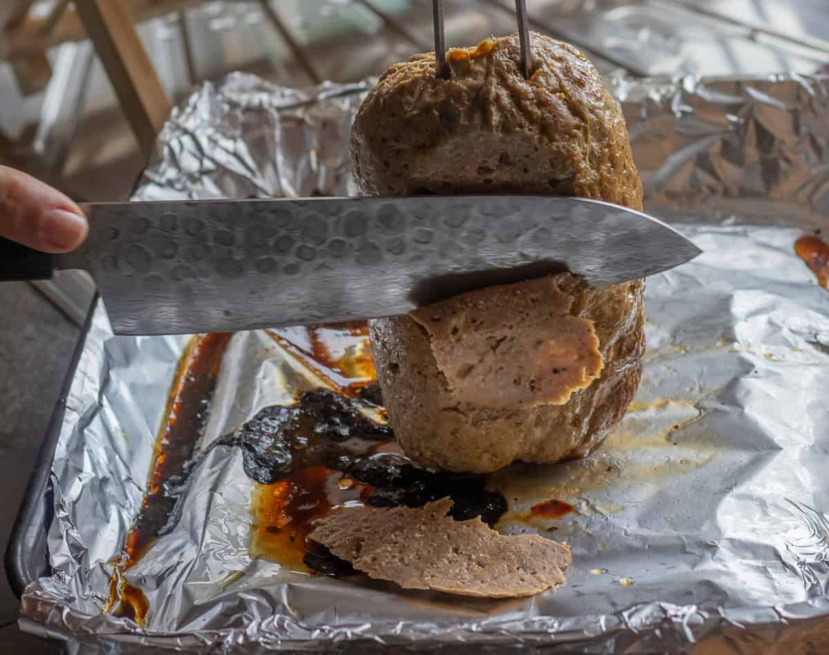 slicing the doner kebab on tray