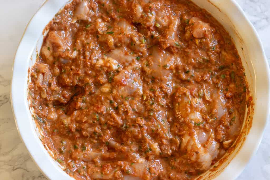 chicken thighs are covered with marinate