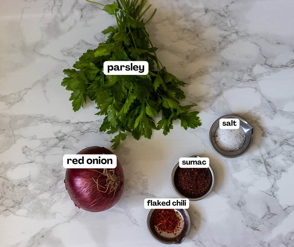 labelled picture of ingredients for sumac onion salad