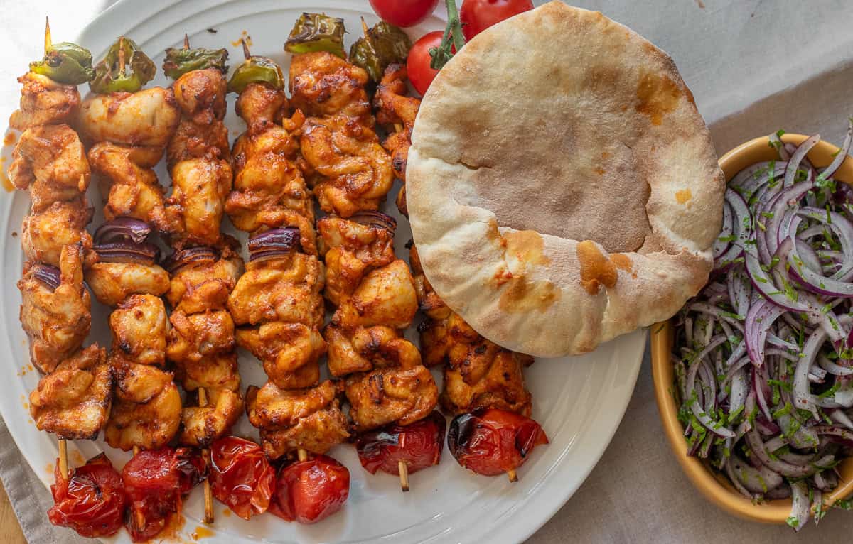 sumac onions - Turkish red onion salad served with chicken kebabs