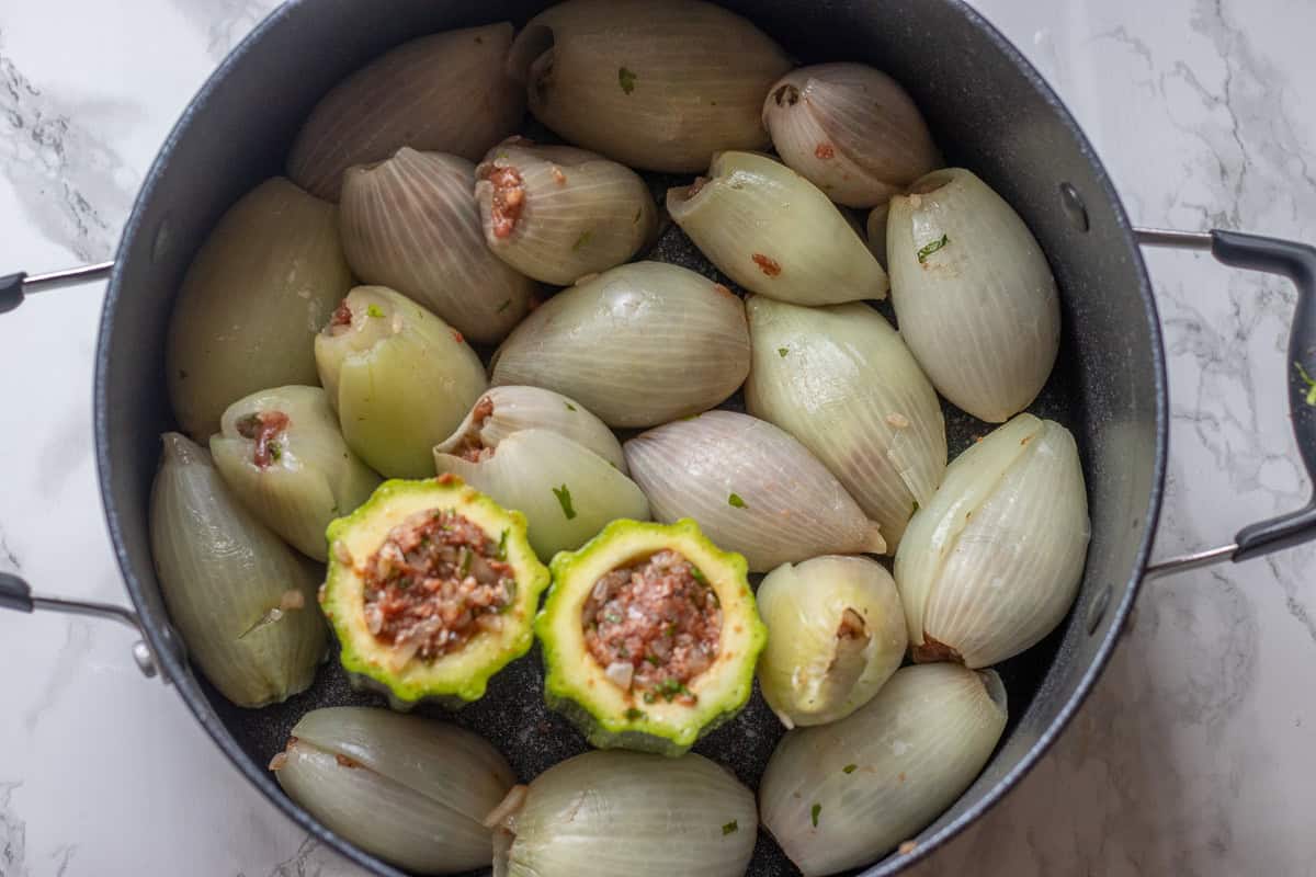 onion shells are stuffed with meat filling