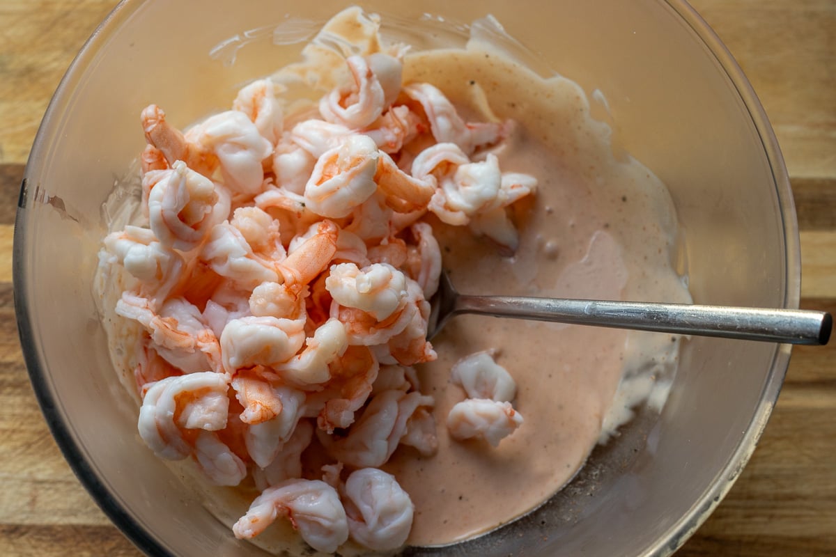 prawns are tossed in cocktail sauce