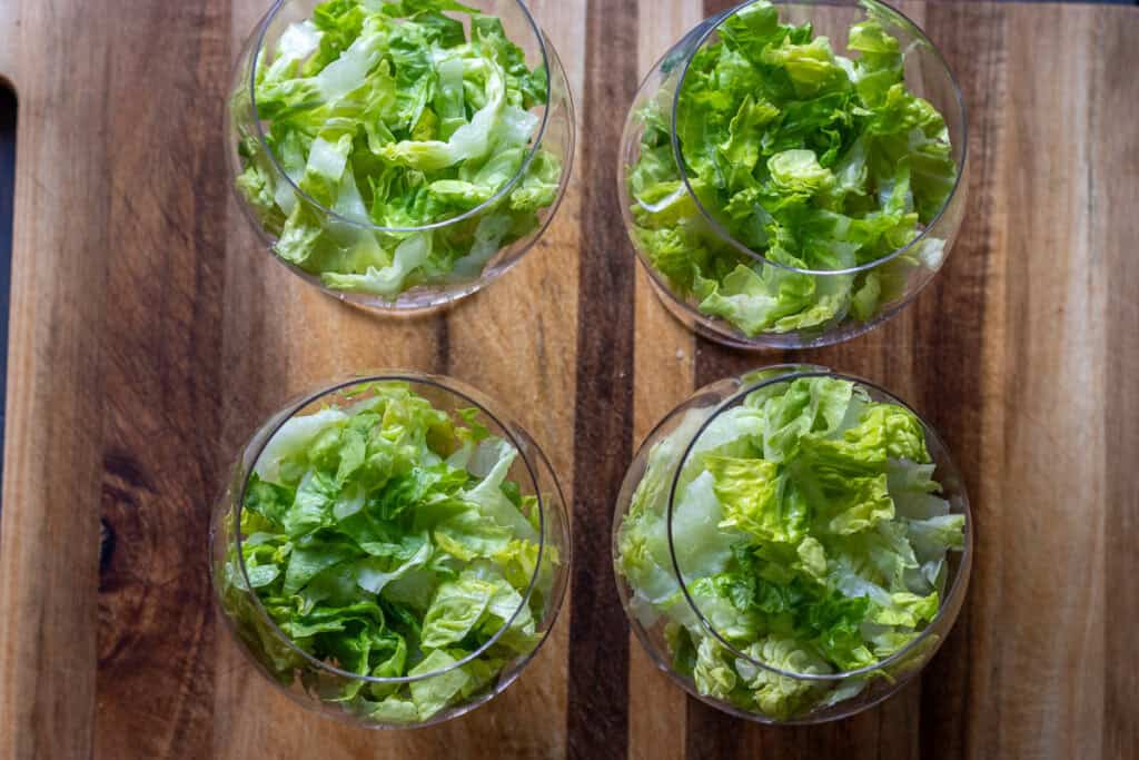 diced avocado is placed on top of lettuce