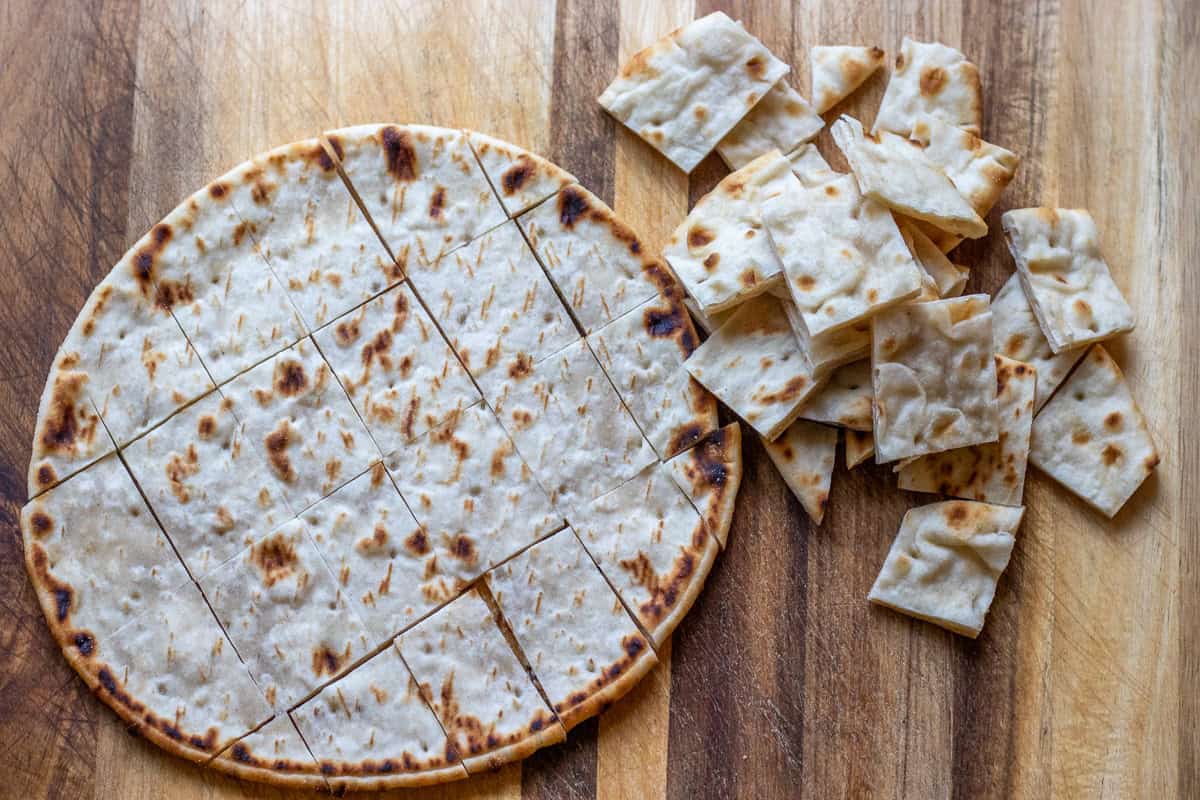 pita bread is cut into bite sized cubes