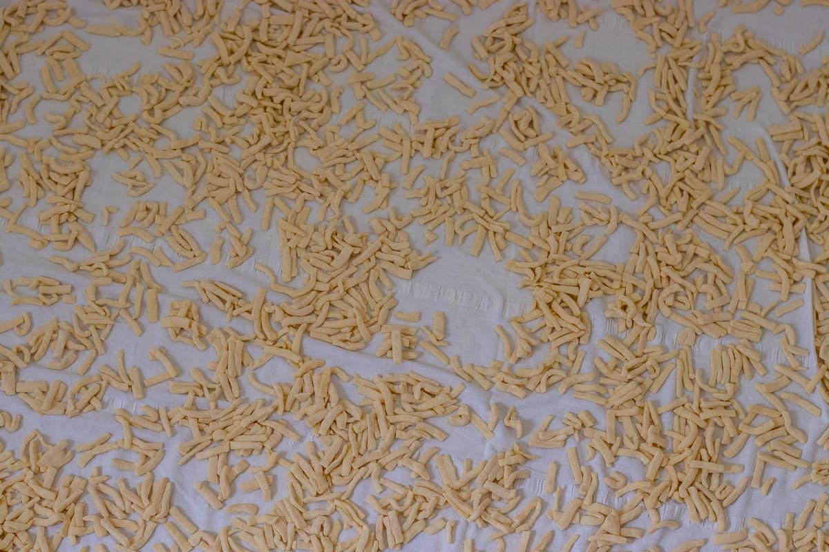 drying freshly cut Turkish egg noodles on clean sheets