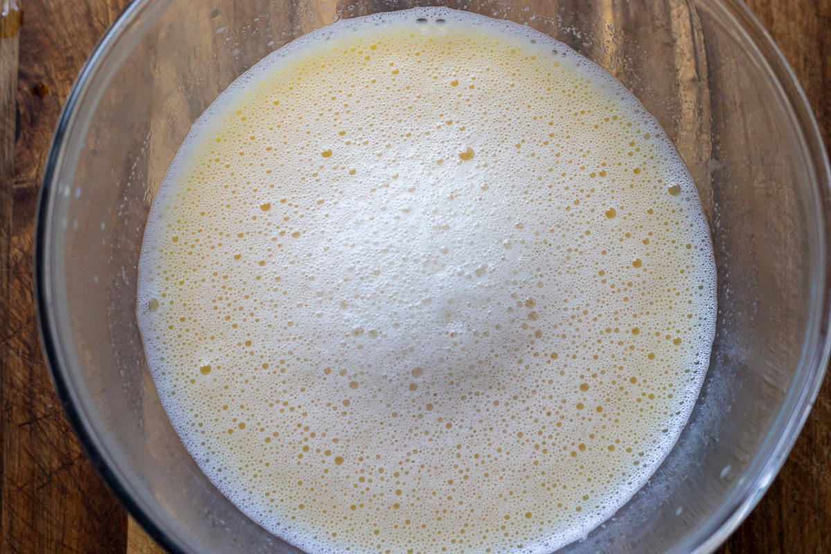 Hot stock is incorporated with lemon and egg mixture.