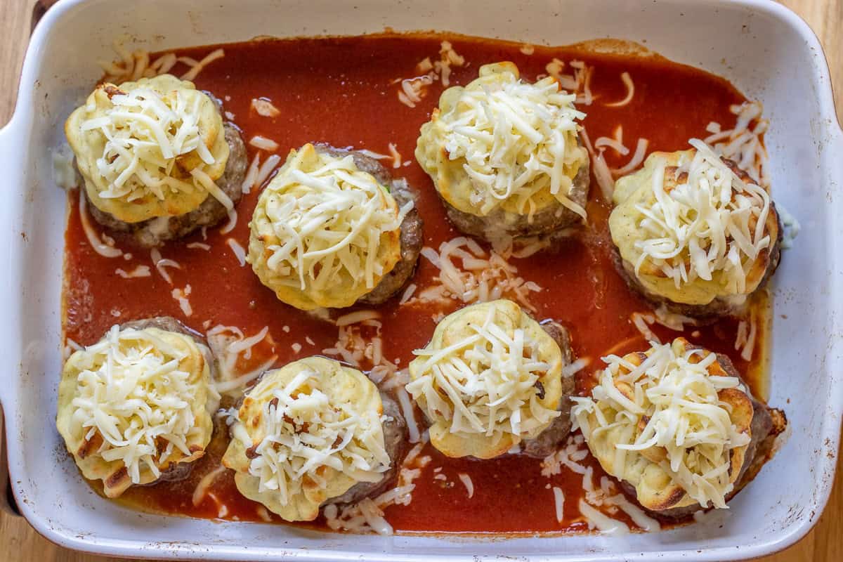 hasanpasa kofte topped with cheese before second baking