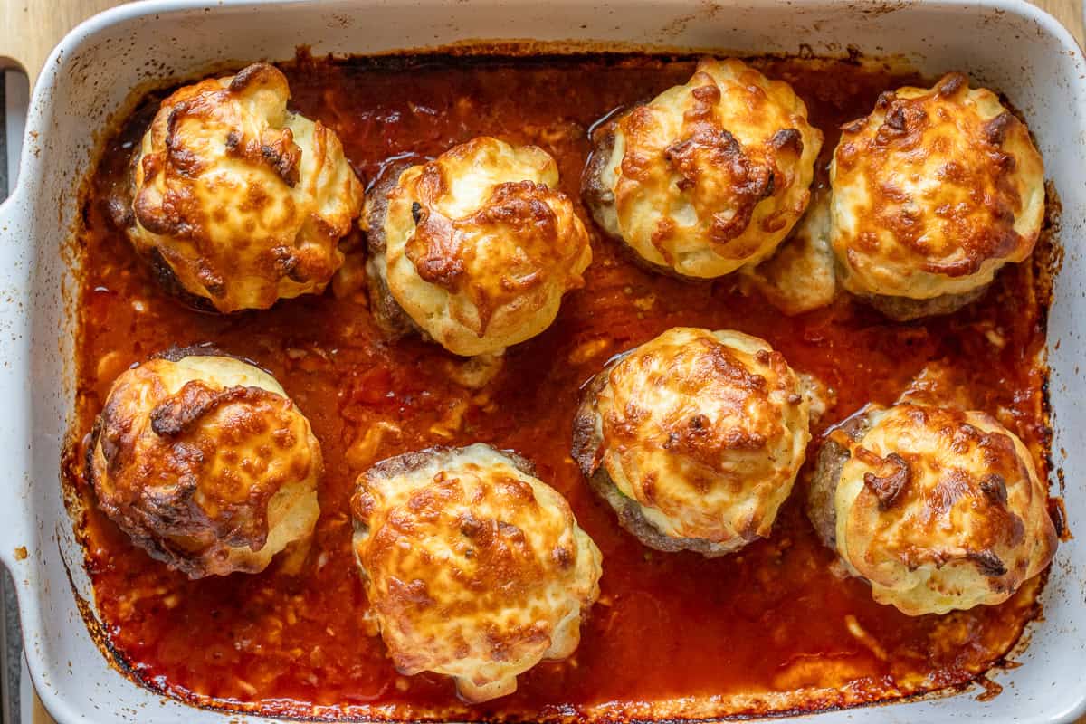 8 pieces of hasanpasa koftesi baked in an oven dish