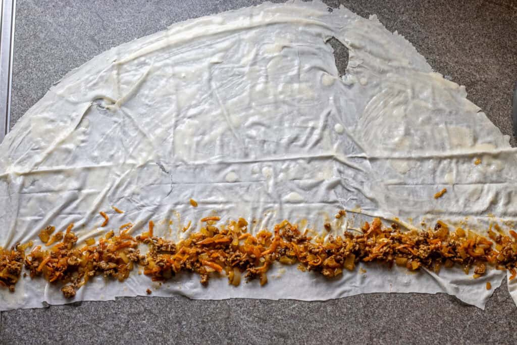 2-3 tablespoons of filling placed on yufka sheet