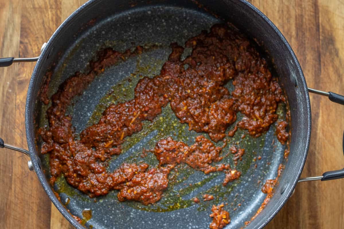 sautéing red pepper and tomato paste along with the spices and seasoning