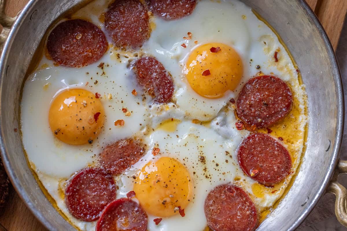 Turkish spicy sausages cooked in butter with 3 eggs