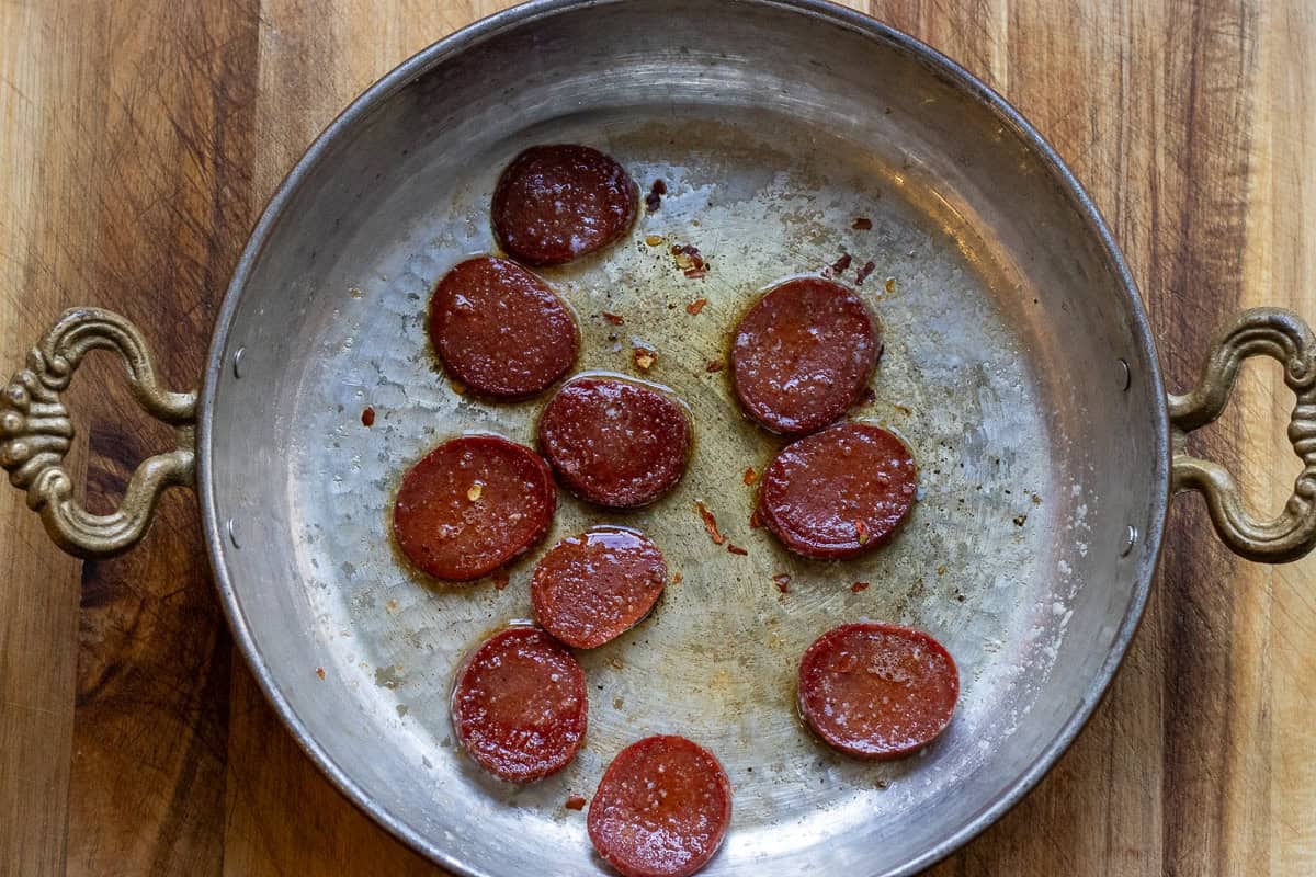 sucuk slices are cooked on both sides until brown