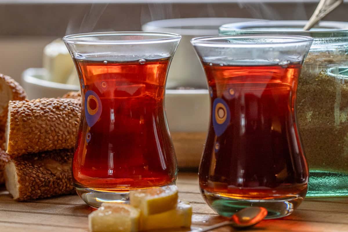 2 glasses of Turkish tea served with lemon slices