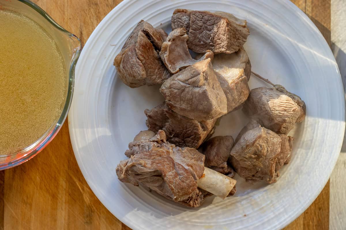 slow cooked lamb pieces and the stock