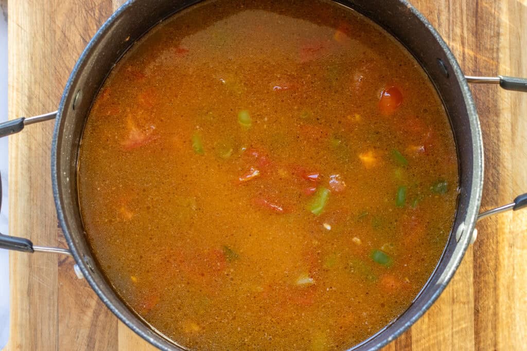 rice and stock are added to the pan