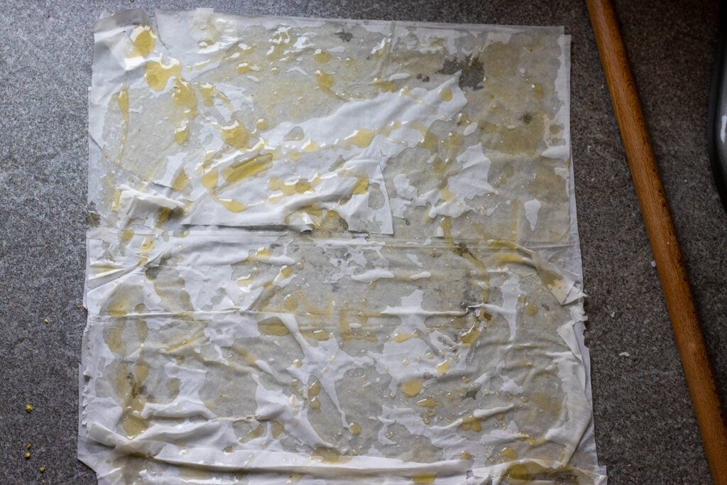 ground pistachio scattered over phyla sheets