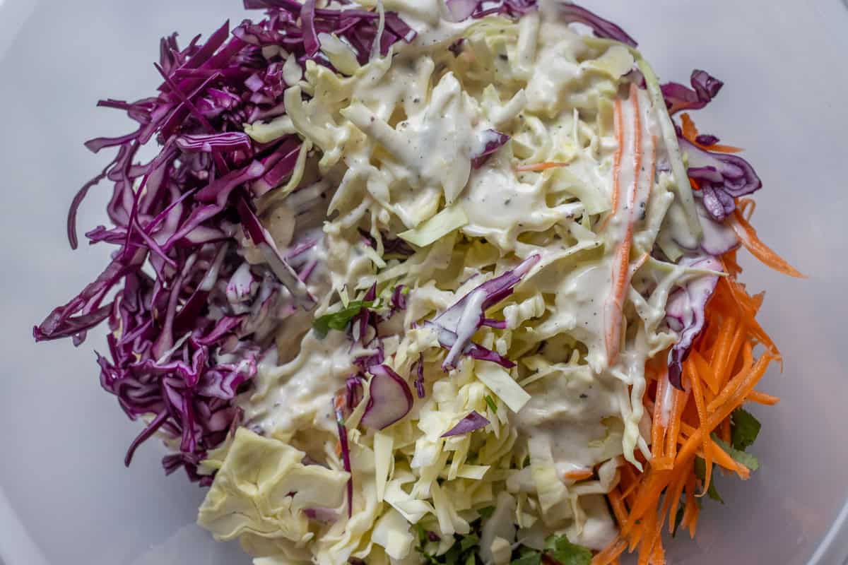 dressing is poured over shredded vegetables