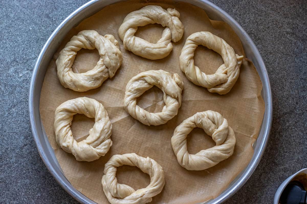 shaped acma rings are placed on a baking tray