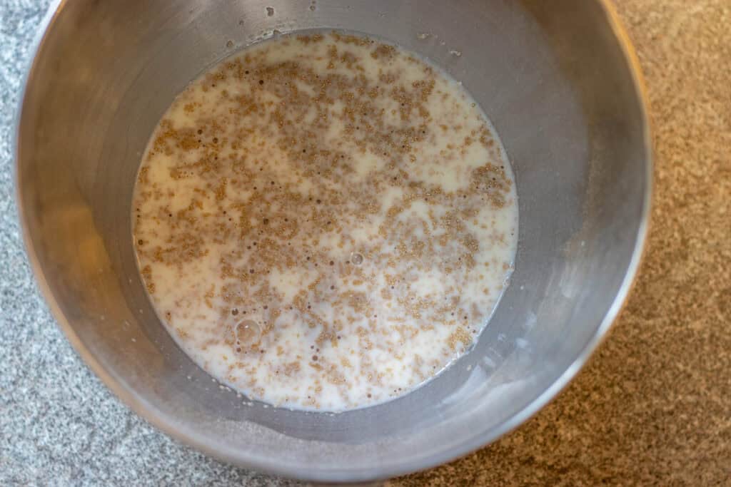 warm milk, sugar, and yeast are placed in a bowl