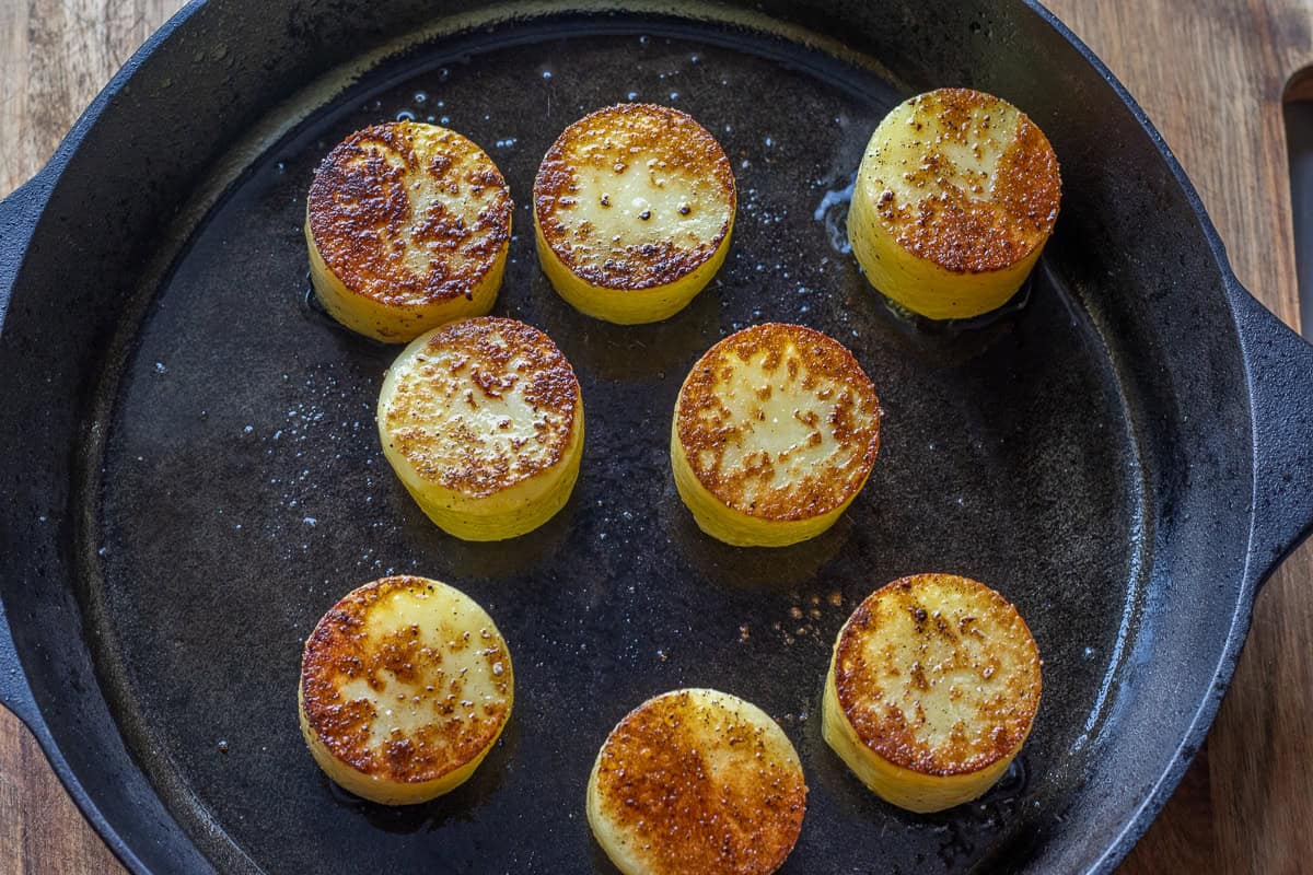 searing the potatoes with olive oil in a skillet
