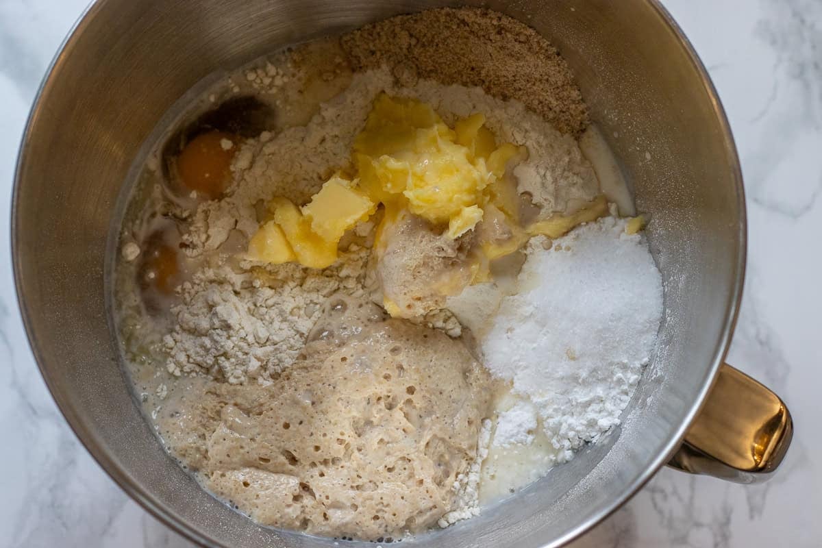 activated yeast, flour, softened butter, milk and salt are placed in a mixing bowl