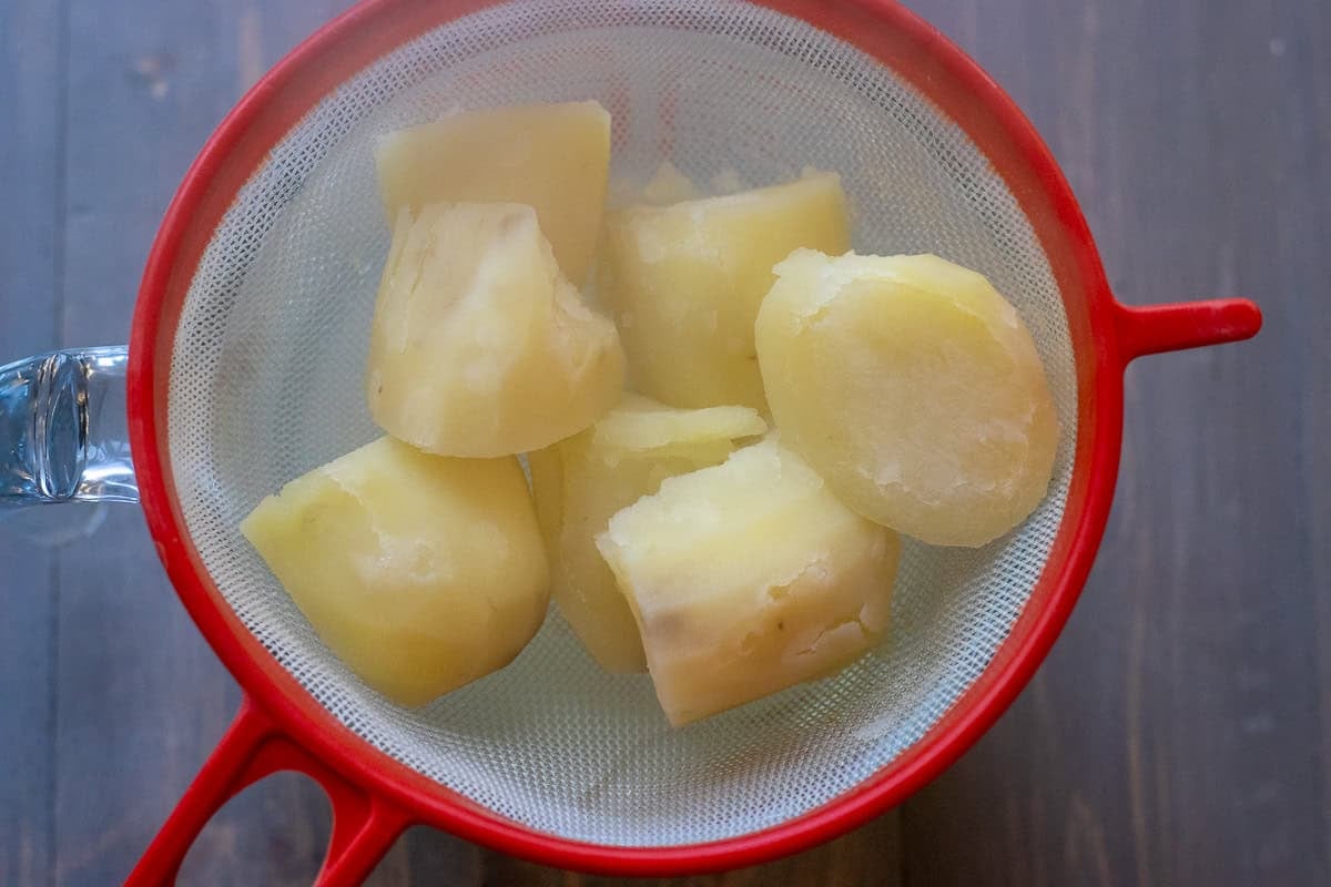 cooked potatoes drained and placed in a sieve