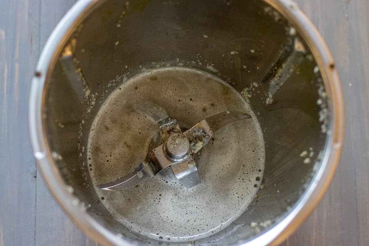 garlic is blitzed in water and vinegar