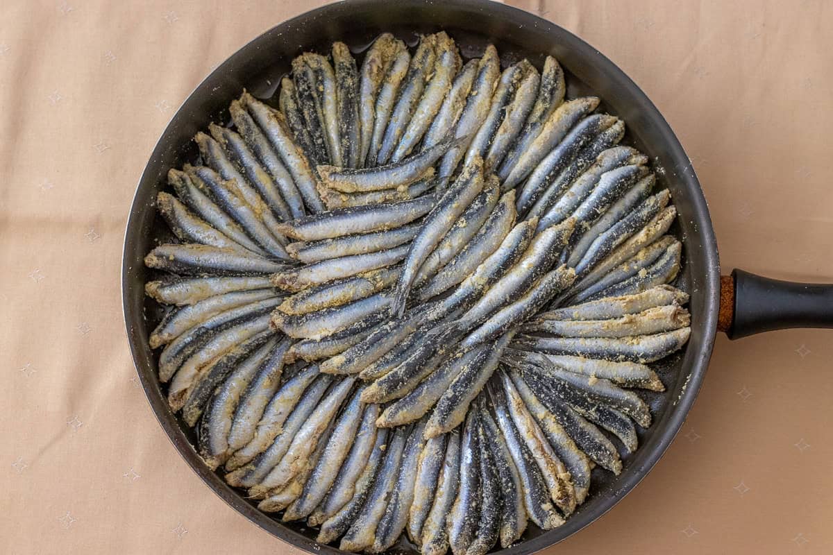 anchovies are arranged on a pan