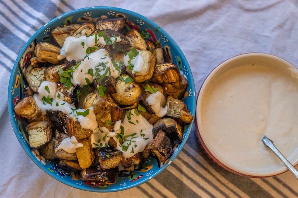 Mediterranean style roasted eggplant served with tahini sauce