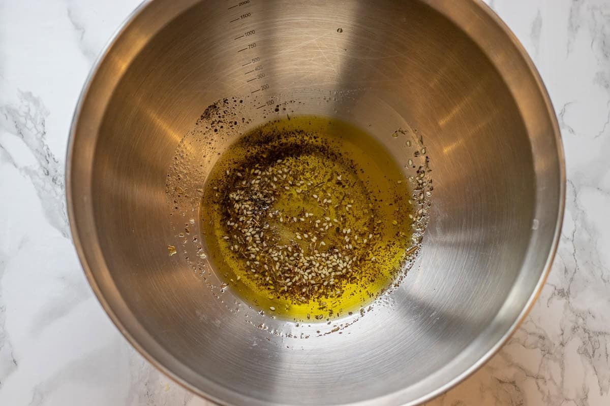 olive oil and seasoning mixed in a bowl