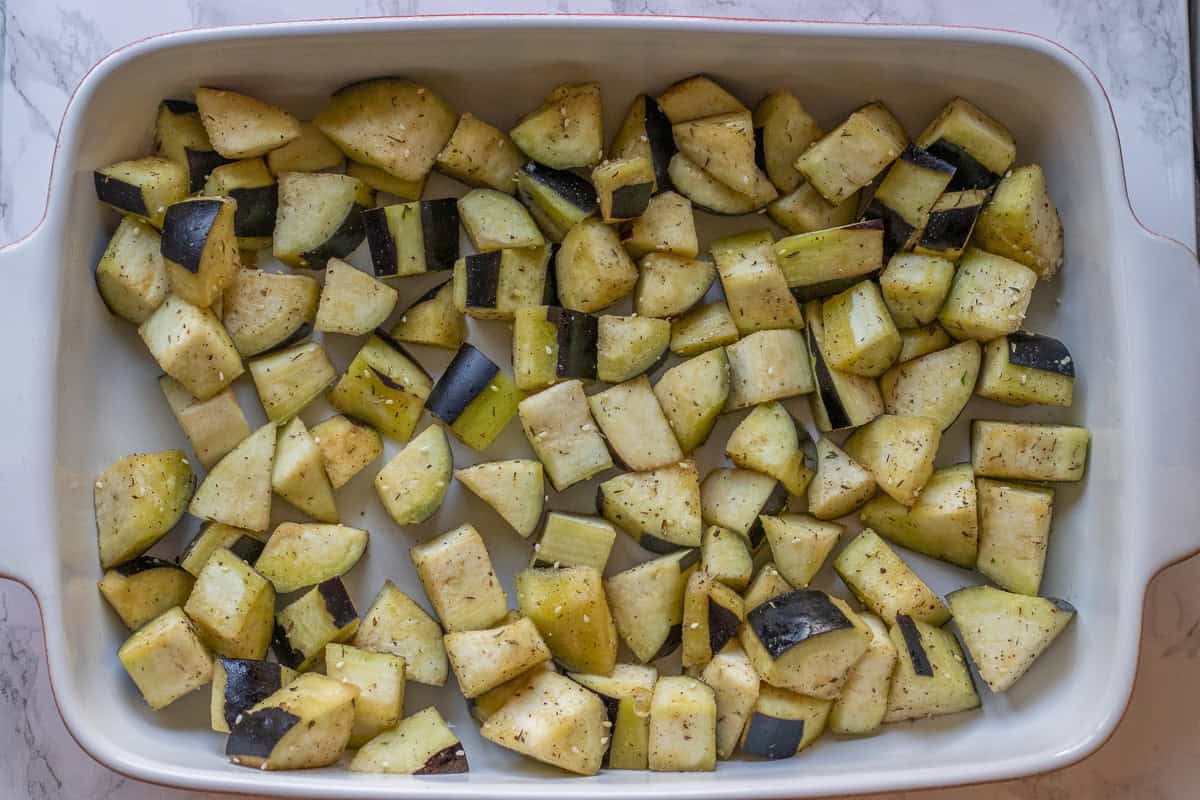 seasoned eggplants arranged on a baking dish