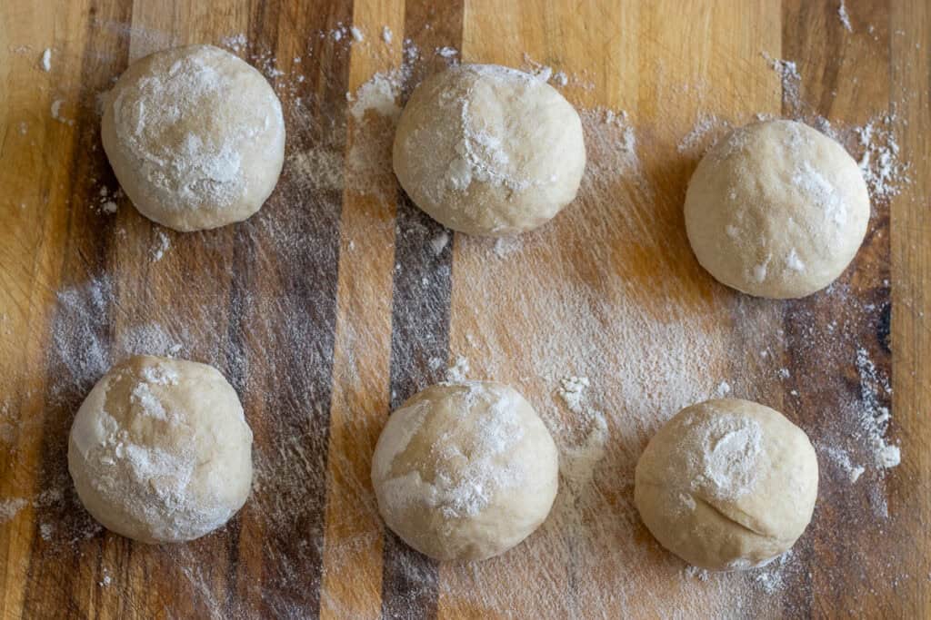 the dough has been divided into 6 equal balls