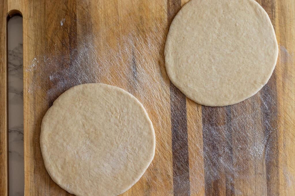 two dough balls are shaped into circles
