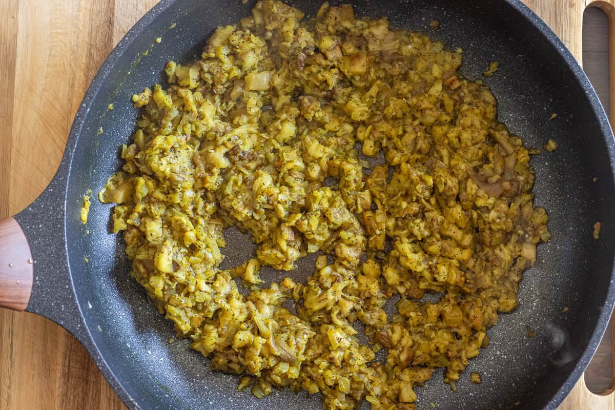 roasted eggplants are added to sautéed onions and spices